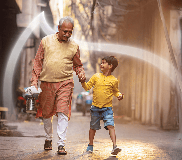 A farmer walking with a child through a water spray arch